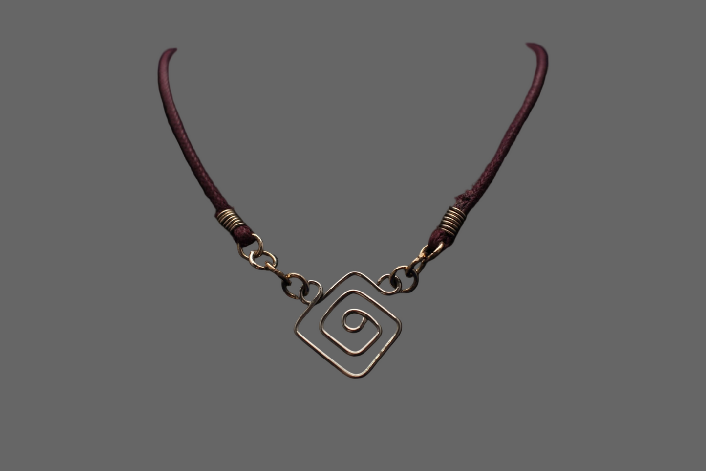 Sterling silver hand shaped pendant on purple extendable leather cord necklace.