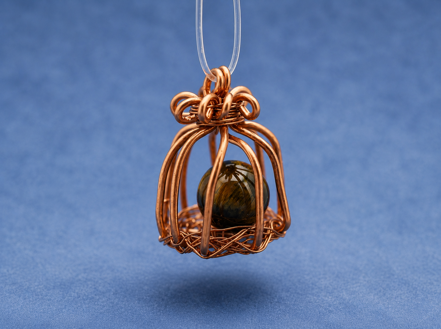 Handcrafted Copper Wire Cage Pendant with Tiger's Eye
