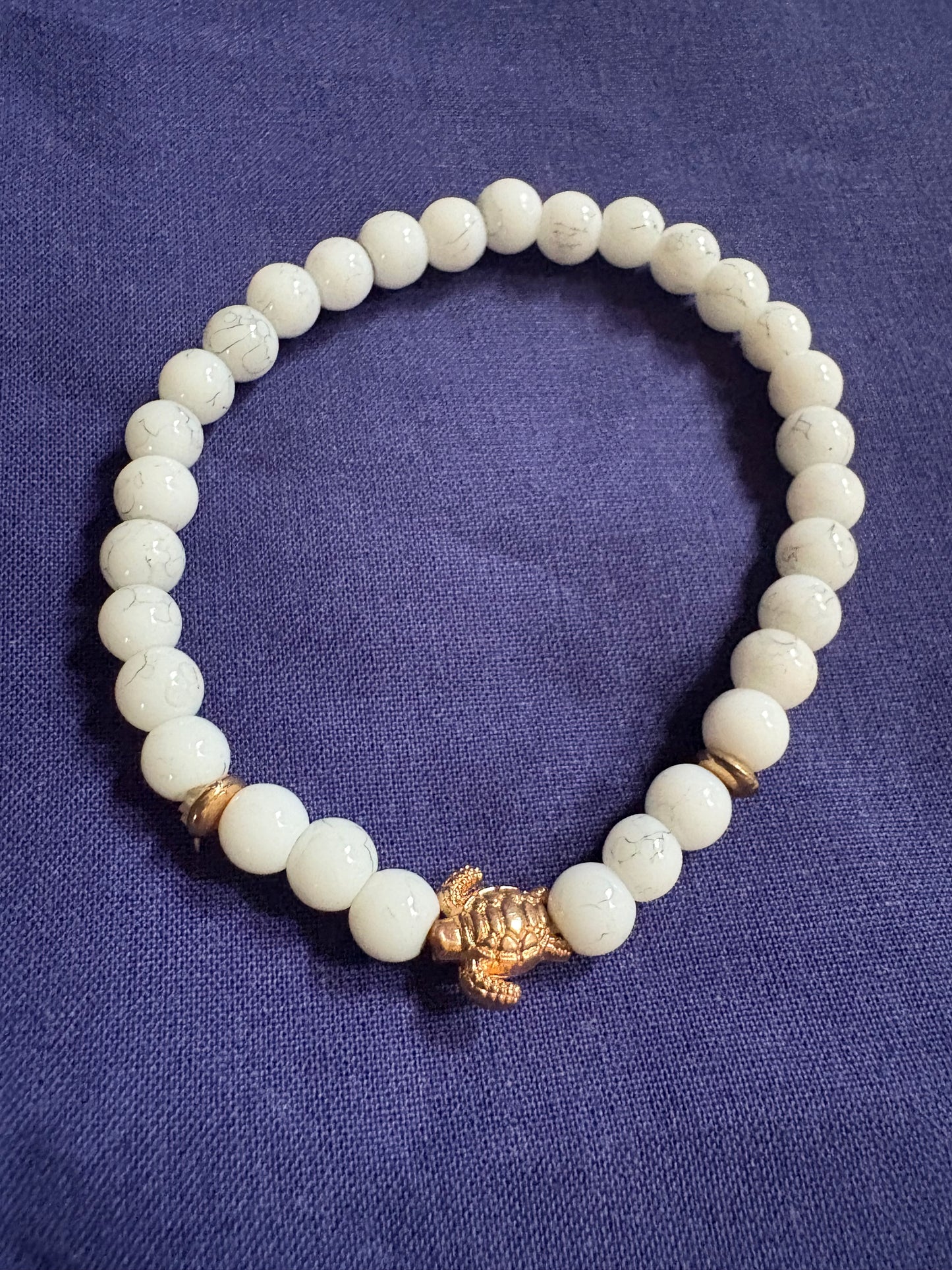 White Beaded Bracelet with Gold coloured Turtle Charm