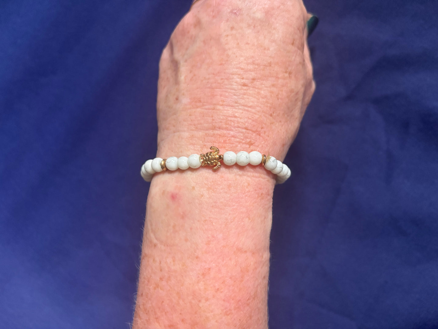 White Beaded Bracelet with Gold coloured Turtle Charm