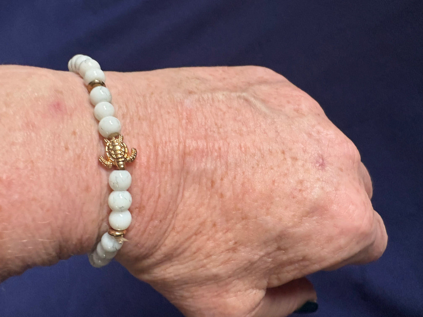 White Beaded Bracelet with Gold coloured Turtle Charm
