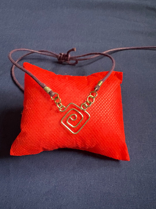 Sterling silver hand shaped pendant on purple extendable leather cord necklace.