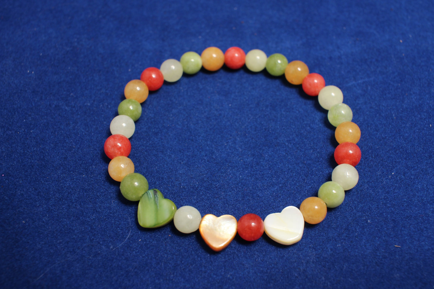 6mm mixed gemstone with 3 love heart to form focal piece elasticated bracelet